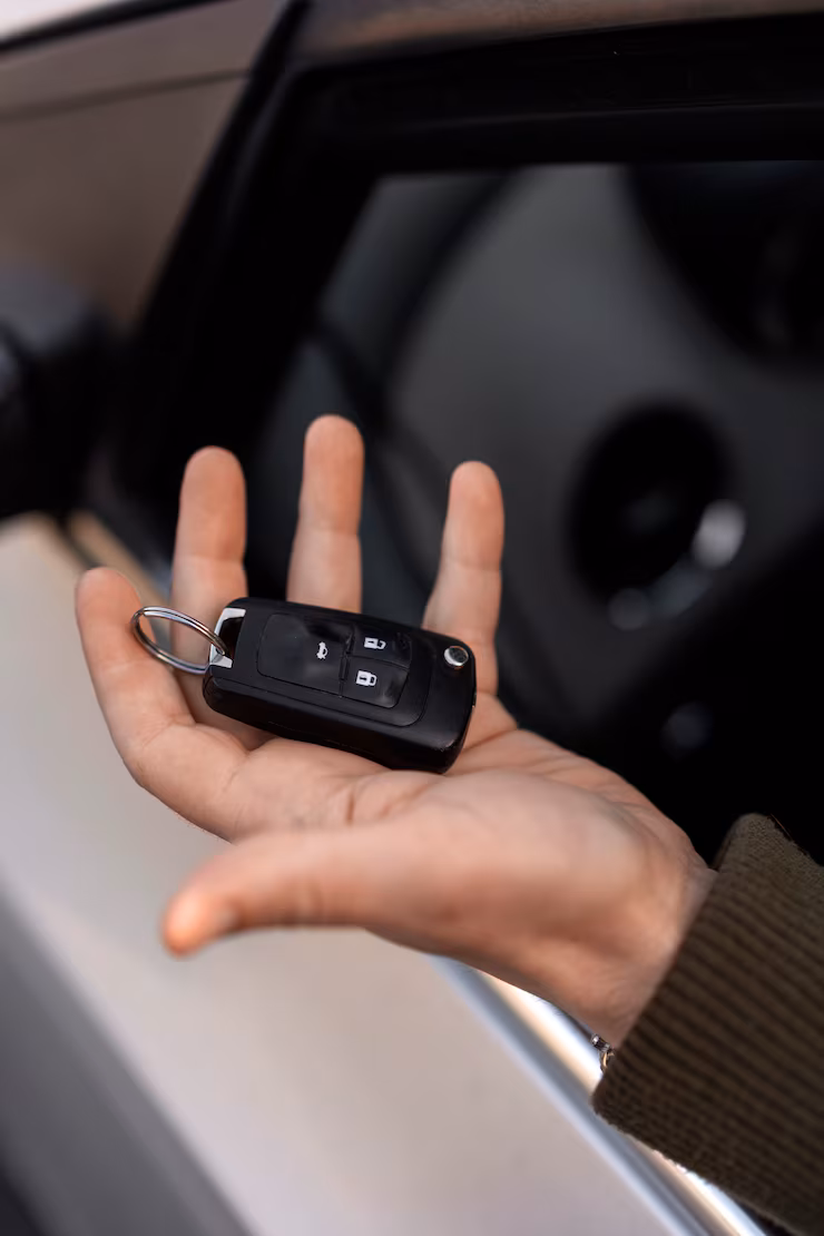 high-angle-hand-holding-car-key-secure-key-pros